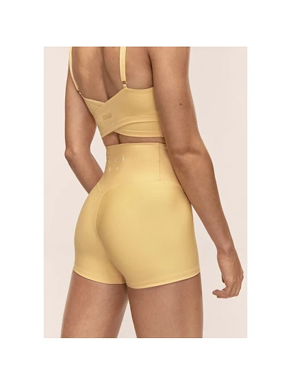 Dámské tréninkové legíny CASALL Ultra High Waist Hot Pant, žlutá barva Dámské tréninkové legíny CASALL Ultra High Waist Hot Pant, žlutá barva