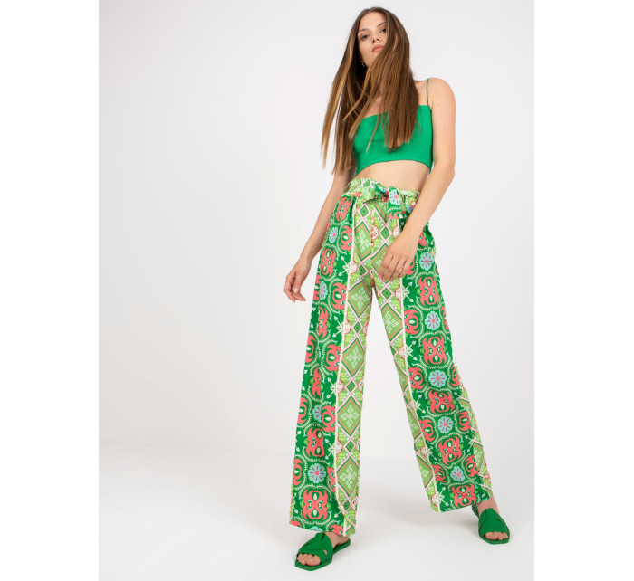 Zelené vzorované látkové kalhoty se širokou nohavicí
