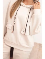 Komplet dámský máslový mikina s kapucí a kalhoty s páskem béžový Komplet dámský máslový mikina s kapucí a kalhoty s páskem béžový