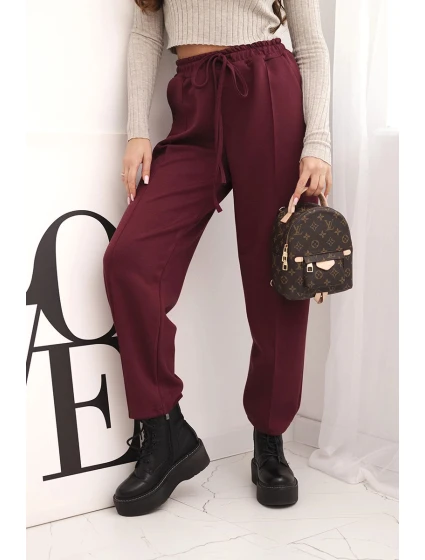 Elegantní dámské kalhoty s vysokým pasem a vázáním v pase bordó Elegantní dámské kalhoty s vysokým pasem a vázáním v pase bordó