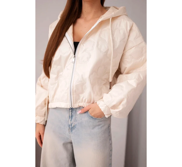 Dámská prošívaná bunda s kapucí a ozdobným květinovým ražením béžová