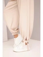 Dámské kalhoty s širokým nohavicí a vázáním dole béžové