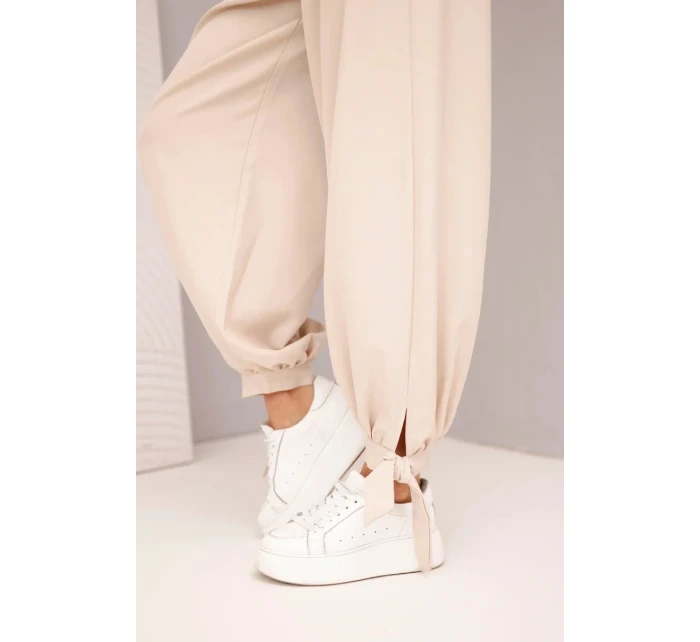 Dámské kalhoty s širokým nohavicí a vázáním dole béžové