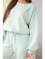 Dámský komplet máslová mikina s broží a kalhoty s rovnou nohavicí tmavě mátová Dámský komplet máslová mikina s broží a kalhoty s rovnou nohavicí tmavě mátová