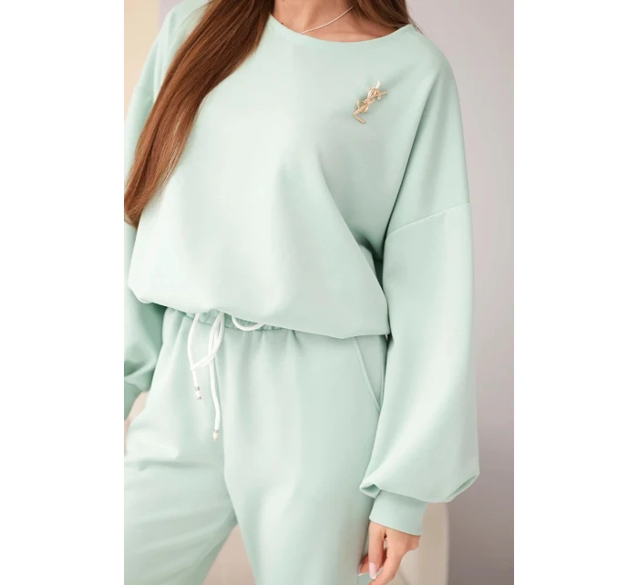 Dámský komplet máslová mikina s broží a kalhoty s rovnou nohavicí tmavě mátová Dámský komplet máslová mikina s broží a kalhoty s rovnou nohavicí tmavě mátová