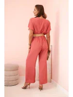 Kombinéza s ozdobným páskem v pase tmavě růžová Kombinéza s ozdobným páskem v pase tmavě růžová