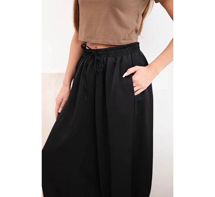 Dámské široké kalhoty s gumou v pase a vázáním ve stylu model 22064413 černé - K-Fashion
