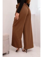 Dámské kalhoty elegantní se širokou nohavicí a ozdobným květem světle hnědé Dámské kalhoty elegantní se širokou nohavicí a ozdobným květem světle hnědé