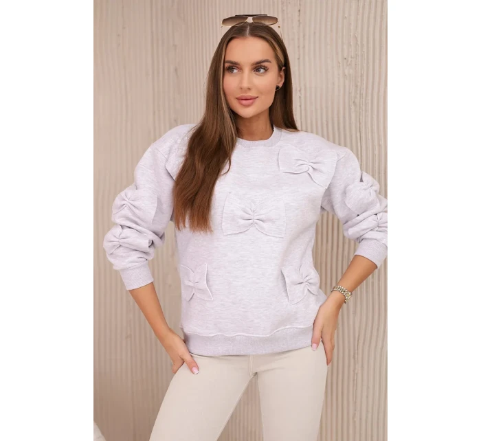 Zateplená mikina se stahovacím lemem a ozdobnými mašličkami béžová melanž