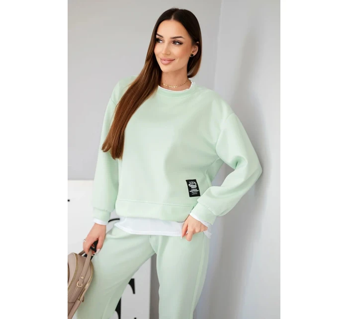 Dámský komplet s máslovou barvou, volnou mikinou a tepláky jasně mátová Dámský komplet s máslovou barvou, volnou mikinou a tepláky jasně mátová