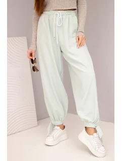 Dámské kalhoty se širokými nohavicemi a zavazováním dole tmavě mátové