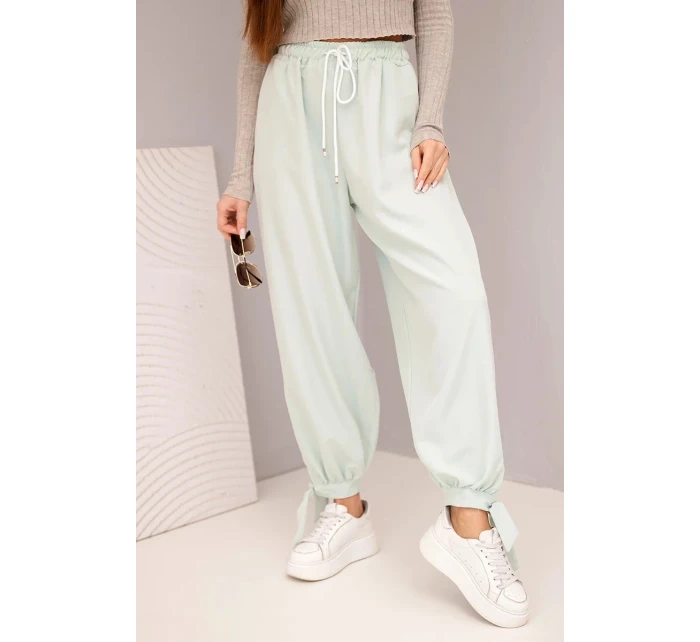 Dámské kalhoty se širokými nohavicemi a zavazováním dole tmavě mátové
