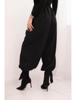 Dámské kalhoty s širokou nohavicí a zavazováním dole černé Dámské kalhoty s širokou nohavicí a zavazováním dole černé