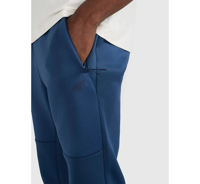 Pánské rychleschnoucí tréninkové kalhoty model 22071382 - 4F Pánské rychleschnoucí tréninkové kalhoty model 22071382 - 4F