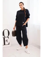 Dámská tepláková souprava z materiálu se širokými nohavicemi model 21489458 - K-Fashion Dámská tepláková souprava z materiálu se širokými nohavicemi model 21489458 - K-Fashion