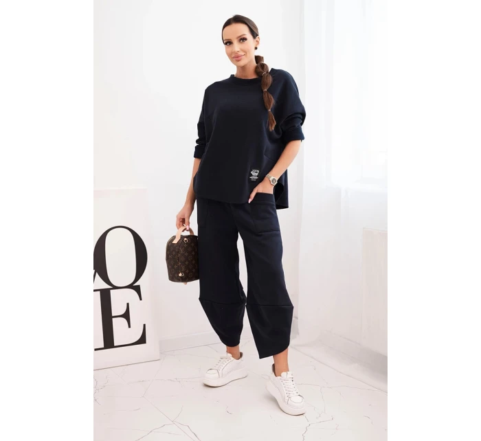 Dámská tepláková souprava z materiálu se širokými nohavicemi model 21489458 - K-Fashion Dámská tepláková souprava z materiálu se širokými nohavicemi model 21489458 - K-Fashion