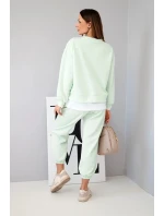 Dámský komplet s volnou mikinou a tepláky jasně mátová model 21808631 - K-Fashion Dámský komplet s volnou mikinou a tepláky jasně mátová model 21808631 - K-Fashion