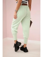 Kalhoty s páskem a kapsami z máslové látky tmavá máta Kalhoty s páskem a kapsami z máslové látky tmavá máta