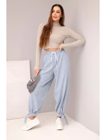 Dámské kalhoty s širokými nohavicemi a zavazováním dole džínové modré