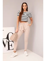 Dámské tepláky s elastickým pasem a šňůrkou béžové Dámské tepláky s elastickým pasem a šňůrkou béžové