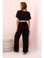 Kombinéza s ozdobným páskem v pase hnědý Kombinéza s ozdobným páskem v pase hnědý