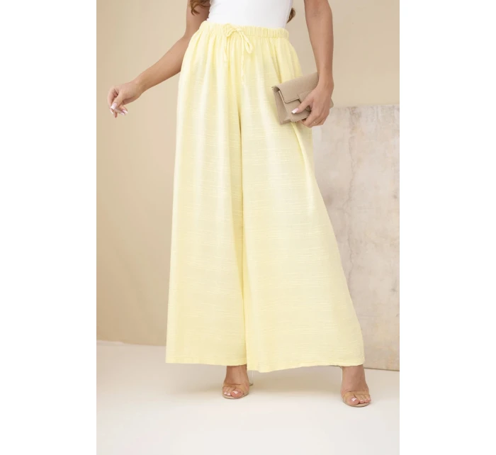 Dámské široké bavlněné kalhoty s gumičkou v pase žluté Dámské široké bavlněné kalhoty s gumičkou v pase žluté