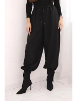 Dámské kalhoty s širokou nohavicí a zavazováním dole černé Dámské kalhoty s širokou nohavicí a zavazováním dole černé