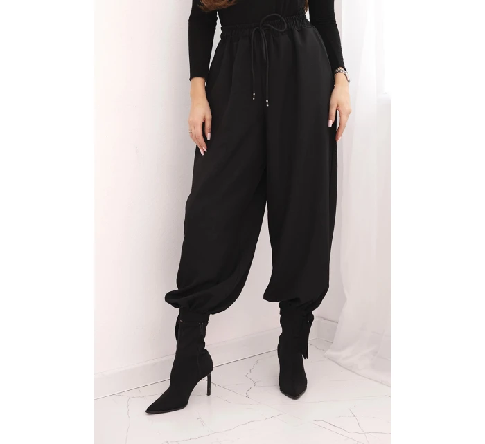 Dámské kalhoty s širokou nohavicí a zavazováním dole černé Dámské kalhoty s širokou nohavicí a zavazováním dole černé