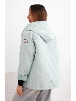 Dámská model 21791609 prošívaná bunda s kapucí a zipem světle mátová - K-Fashion