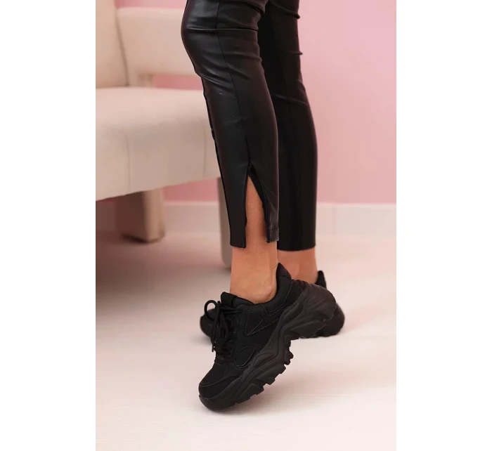 Dámské kalhoty z eko kůže s vázáním a rozparkem na nohavici černé Dámské kalhoty z eko kůže s vázáním a rozparkem na nohavici černé