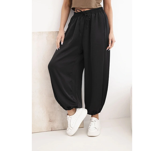 Dámské široké kalhoty s gumou v pase a vázáním ve stylu model 22064413 černé - K-Fashion