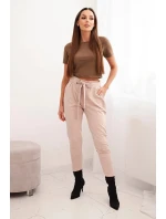 Dámské kalhoty z bavlny s vázáním v pase a zúženými nohavicemi béžové Dámské kalhoty z bavlny s vázáním v pase a zúženými nohavicemi béžové