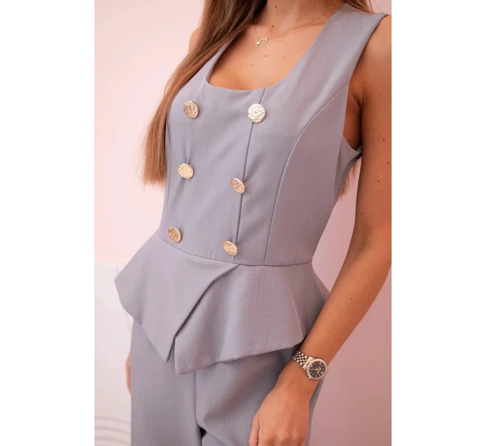 Dámská kombinéza bez rukávů s širokými nohavicemi a ozdobnými knoflíky šedý Dámská kombinéza bez rukávů s širokými nohavicemi a ozdobnými knoflíky šedý