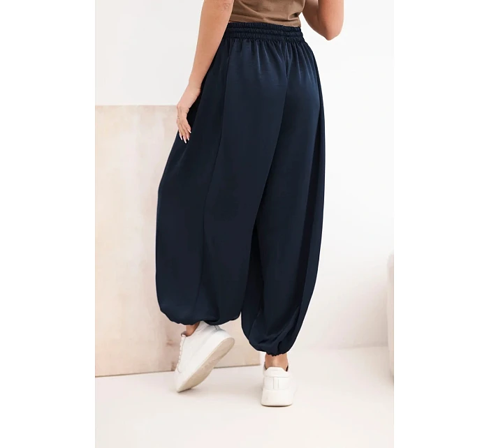 Dámské široké kalhoty s gumou v pase a vázáním typu model 22064417 - K-Fashion Dámské široké kalhoty s gumou v pase a vázáním typu model 22064417 - K-Fashion