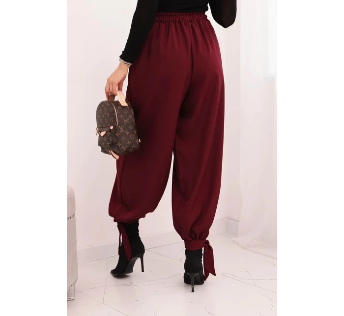 Dámské kalhoty s širokým nohavicí a zavazováním dole bordové