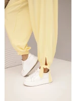 Dámské kalhoty s širokým nohavicím a zavazováním dole žluté