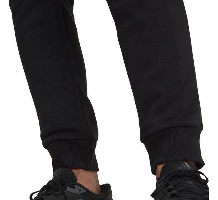 Fleecové kalhoty adidas Essentials Camo Print M HL6929