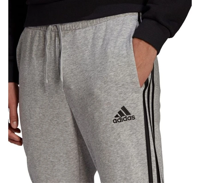 Pánské kalhoty Essentials Fleece M model 16053227 - ADIDAS Pánské kalhoty Essentials Fleece M model 16053227 - ADIDAS