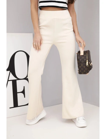 Dámské kalhoty máslo s rozšiřující se nohavicí béžové