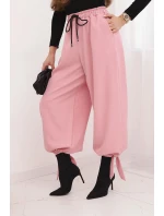 Dámské kalhoty s širokým nohavicí a vázáním dole světle růžové Dámské kalhoty s širokým nohavicí a vázáním dole světle růžové