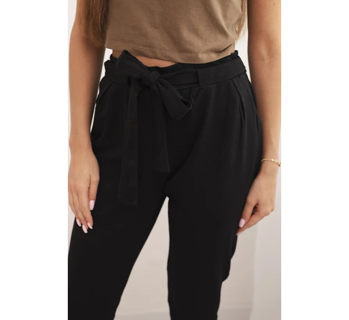 Dámské bavlněné kalhoty s v pase a nohavicí černé model 21768708 - K-Fashion Dámské bavlněné kalhoty s v pase a nohavicí černé model 21768708 - K-Fashion