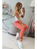 Tmavě meruňkové džínové kalhoty