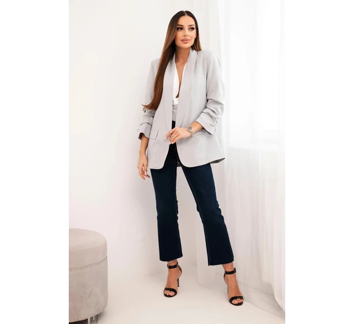 Šedé sako s klopami elegantní