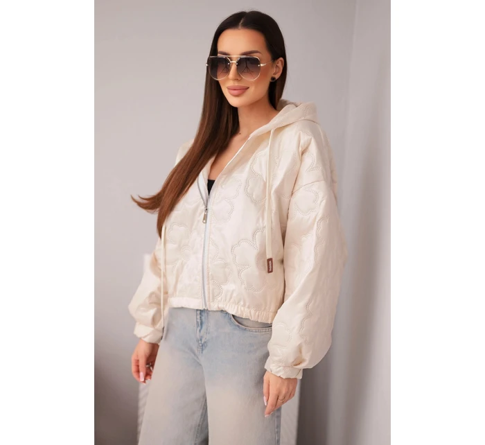 Dámská prošívaná bunda s kapucí a ozdobným květinovým ražením béžová
