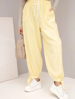 Dámské kalhoty s širokým nohavicím a zavazováním dole žluté