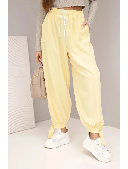 Dámské kalhoty s širokým nohavicím a zavazováním dole žluté