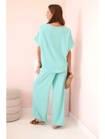 Dámský komplet z viskózy s ozdobným květem a širokými kalhotami - mátový Dámský komplet z viskózy s ozdobným květem a širokými kalhotami - mátový