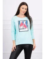 Halenka s 3D grafikou plameňáka v mátové barvě