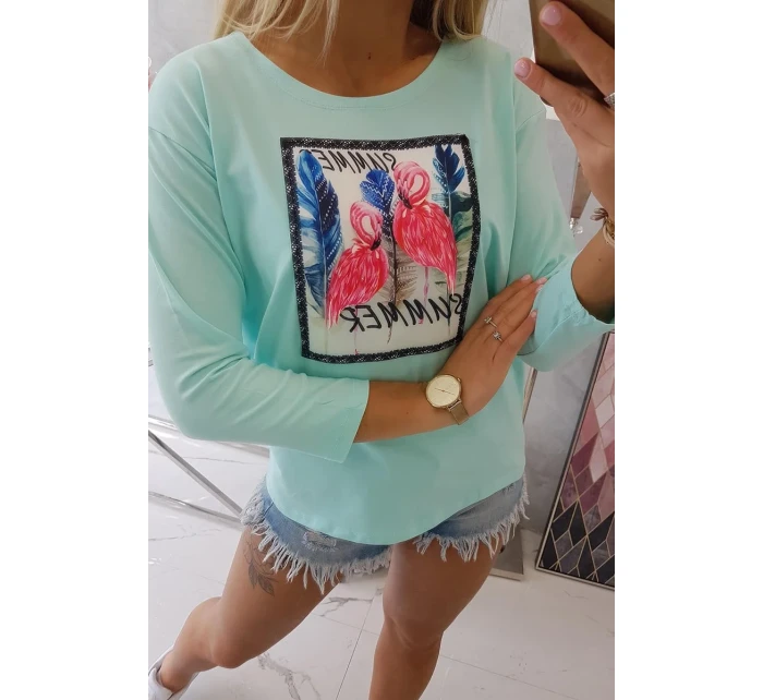 Halenka s 3D grafikou plameňáka v mátové barvě