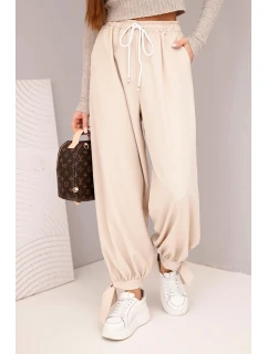 Dámské kalhoty s širokým nohavicí a vázáním dole béžové
